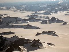 02B Small Mountains Stick Up From The Juneau Alaska Icefield From An Airplane 1999