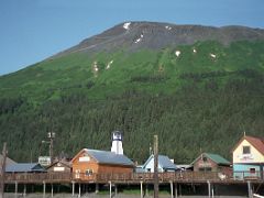 03B Shops Line The Boardwalk At The Boat Harbour With Marathon Mountain Behind In Seward Alaska
