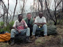 01A Guide, Jerome Ryan And Porter Cook Resting On The Hike Between Machame Camp And Shira Hut Camp On Day 2 Of The Machame Route Climbing Mount Kilimanjaro Kili October 2000