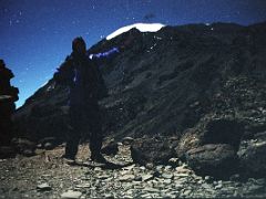 01A Jerome Ryan With Stars Shining Overhead Points To Mount Kilimanjaro Summit From Barafu Camp At Around 1am Before Starting The Climb To The Summit October 11, 2000