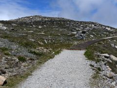 03A The Kosciuszko Summit Walking Track Continues To Contour With The Mount Kosciuszko Summit Above On The Mount Kosciuszko Australia Hike