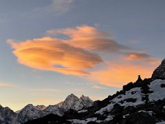 09C Orange lenticular cloud over Kangtega at sunrise from Lobuche East Base Camp 5170m