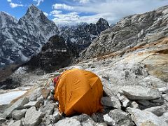 01C Guide Lal Sing Tamang sets up our tent at Lobuche East High Camp 5600m with Cholatse beyond