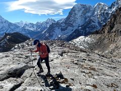 01B Climbing on the rocky slabs above Base Camp with Ama Dablam and Taboche beyond on the way to Lobuche East High Camp 5600m