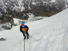 08C I clip into the fixed ropes and use my ascender to climb the steep snow slope on the Lobuche East Peak summit climb