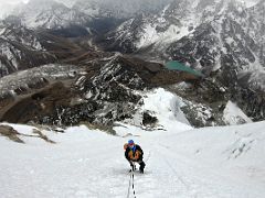 09B Climbing the steepest snow slope using fixed ropes and my ascender with Khumbu Glacier and Cholatse Tso Lake below on the Lobuche East Peak summit climb