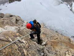 16C Rappelling abseiling down from the last large rock from the Lobuche East summit