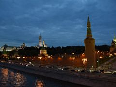 16B Southeast view of the towers and buildings of the Kremlin and Red Square lit up at night from the Bolshoy Moskvoretsky bridge over the Moscow river Russia