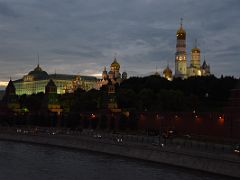 16D Grand Kremlin Palace, Cathedral of the Annunciation, Cathedral of the Dormition Assumption, and towers lit up at night from the Bolshoy Moskvoretsky bridge Russia