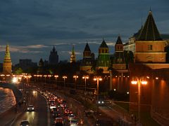 16E Vodovzvodnaya Tower leads a string of other towers to Petrovskaya Tower lit up at night from the Bolshoy Moskvoretsky bridge over the Moscow river Russia
