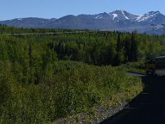 01C Tourist Train With Mountains Beyond Including Mount Baldy In Centre Just After Leaving Anchorage On The Way To Denali National Park Alaska