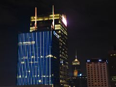 03B The CCB Tower is lit up for the Symphony of Lights with AIA Central, Central Plaza beyond from Sevva rooftop bar Hong Kong