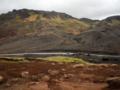 03A Looking back to the Sydristapi cliff view point parking area with the green and black Stapatindur mountain above Reykjanes Peninsula Iceland