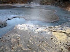04B Steam rising from the boiling hot water with yellow colours of sulphur at Seltun Krysuvík geothermal area Reykjanes Peninsula Iceland