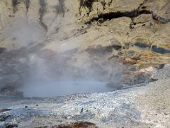 04C Colourful land surrounds steam from boiling hot water at Seltun Krysuvík geothermal area Reykjanes Peninsula Iceland