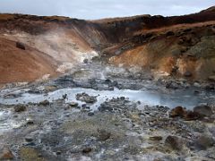 06B Boiling hot water and red and green deposits from the upper boardwalk at Seltun Krysuvík geothermal area Reykjanes Peninsula Iceland