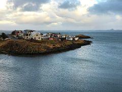 03B Looking across the small Madkavik inlet to the buildings of Stykkisholmur overlooking the ocean from Stykkisholmskirkja church on Snaefellsnes Peninsula Iceland