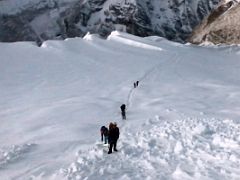 06B Climbers On The Trail Across The Snow Slope To The Steep Climb On Fixed Ropes To The Island Peak Summit