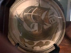 07E The games room has a decorative plate with a sailing boat and fish Devon House mansion Kingston Jamaica