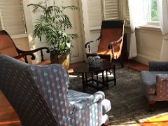 15A The upper vestibule has wing backed and planters chairs Devon House mansion Kingston Jamaica