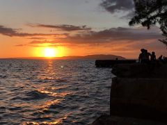 06B The sun starts to set over Kingston Harbour as we sit on the waterfront Kingston Jamaica