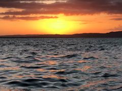 06D Sunset over Kingston Harbour as we sit peacefully and quietly on the waterfront Kingston Jamaica