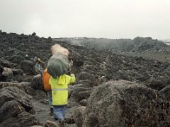 02B My Guide And Porter Cook Trekking Among The Large Boulders Between Shira And Baranco Camps On Day 3 Of The Machame Route Climb Mount Kilimanjaro Kili October 2000