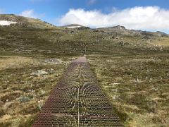 01A The Metal Walkway Leads From Kosciuszko Lookout Toward Rawsons Pass On The Mount Kosciuszko Australia Hike