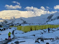 03B The tents of Ak-Sai Travel Lenin Peak Camp 1 4400m after a snowfall with Lenin Peak and the moon beyond in the late afternoon