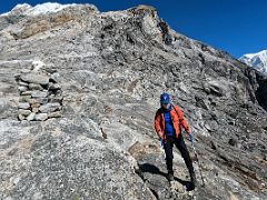 07A Trekking on the fairly smooth large wide rocks with Lobuche Peak behind after climbing the scree slope on the way to Lobuche East Base Camp