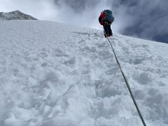 08B Guide Lal Sing Tamang leads the way up the steep snow slope on the Lobuche East Peak summit climb