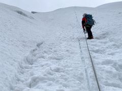 09A Guide Lal Sing Tamang leads the way up the steep snow slope on the Lobuche East Peak summit climb