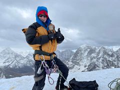 12A Jerome Ryan and Dangles celebrate on the Lobuche East Peak fore summit in cloudy conditions with Ama Dablam and Taboche beyond