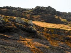 01C Looking up at the towering Hofdakulur mountain with birds flying overhead from Road 54 at Bulandshofdi View Point from Grundarfjordur Snaefellsnes Peninsula Iceland