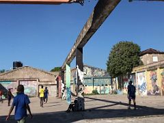 03B Kids play ball in abandoned warehouse home of Paint Jamaica, a street-art movement Marianne Farag launched to beautify the walls of Fleet Street Kingston Jamaica