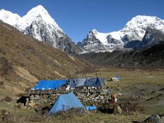 Kangchenjunga 07 05 Ramche Camp with Kabru, Ratong and Koktang Here is our camp for the night at Ramche (4620m). My tent is behind the building run by a family of three from Gunsa, and which serves as the kitchen tent and&hellip;