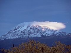 03B The First Rays Of Sunrise On Mount Kilimanjaro Kili As Clouds Form Over The Summit From Moshi Tanzania YMCA In The Pre-Dawn Light On The Way To Climb Kili Kilimanjaro